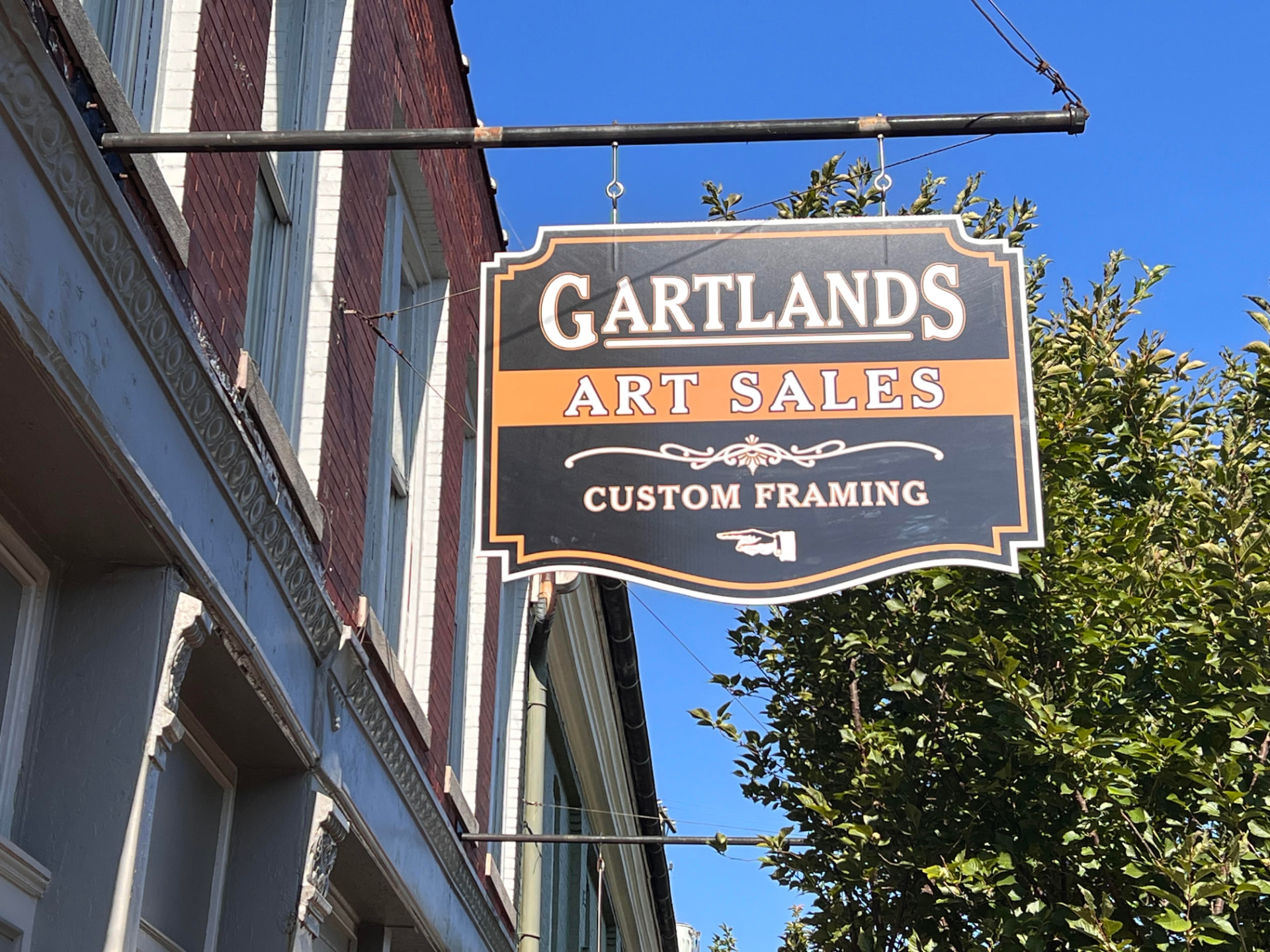 Gartlands Art Sales and Custom Framing hanging sign in downtown Bardstown, Kentucky